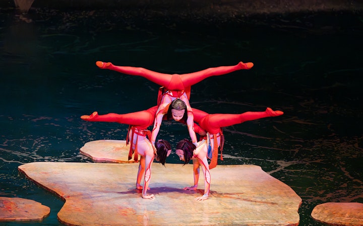 Acrobats performing a balancing act on stage at the O show in Las Vegas.