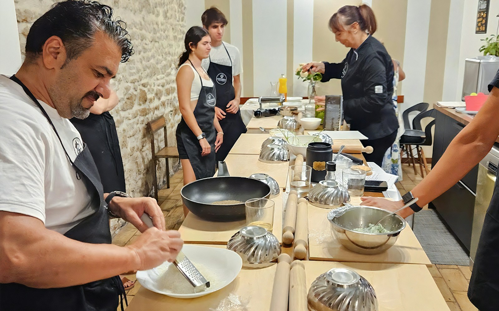 Participants cooking at Rome cooking class