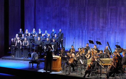 Choir and orchestra performing Theodora in concert.