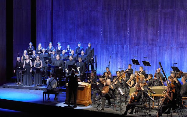 Choir and orchestra performing Theodora in concert.