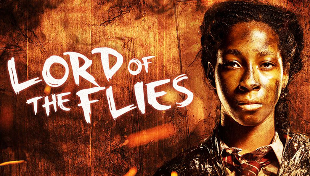 Lord of the Flies poster with character in front of fiery background