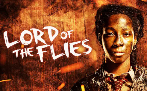 Lord of the Flies poster with character in front of fiery background