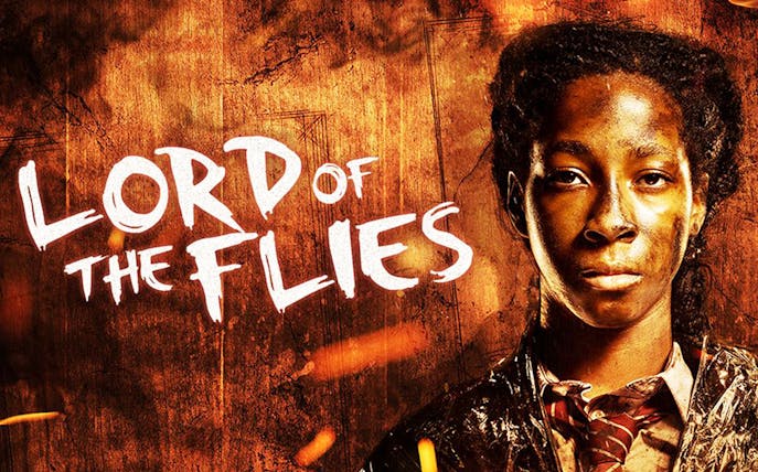 Lord of the Flies poster with character in front of fiery background