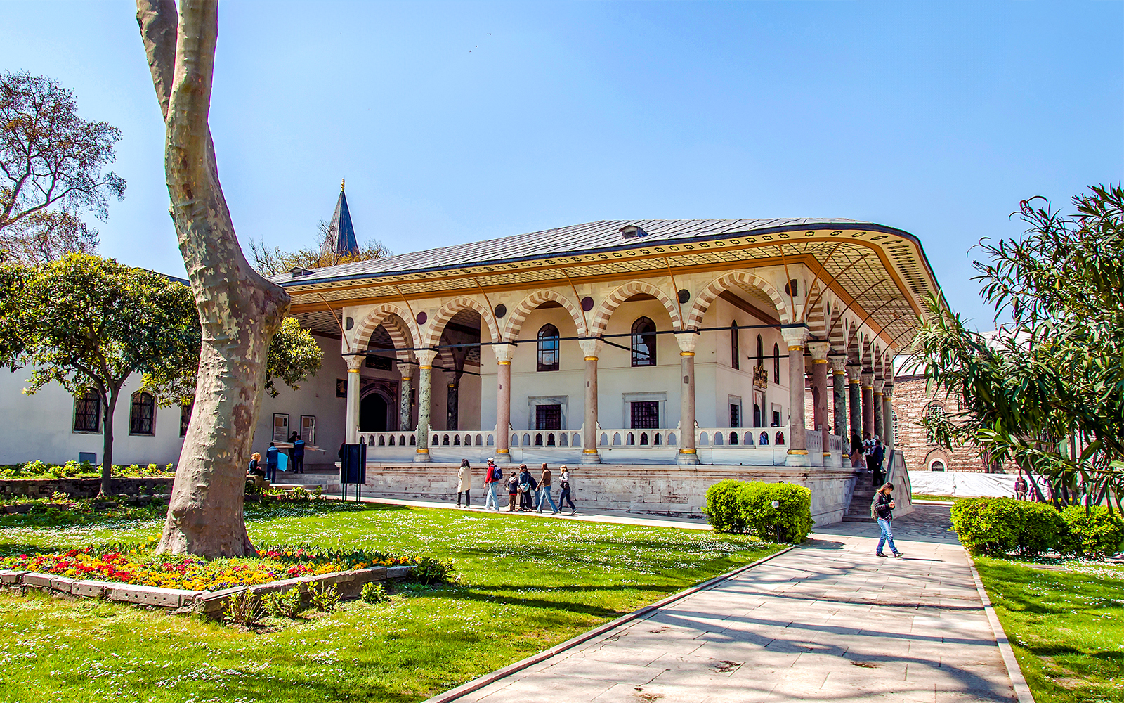 Entrance to Harem and Garden of Topkapi Palace, Istanbul, with visitors exploring.
