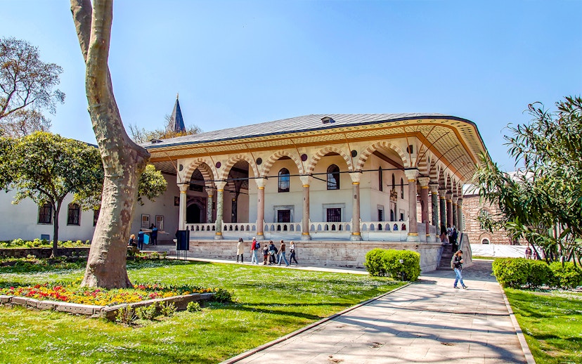 Entrance to Harem and Garden of Topkapi Palace, Istanbul, with visitors exploring.