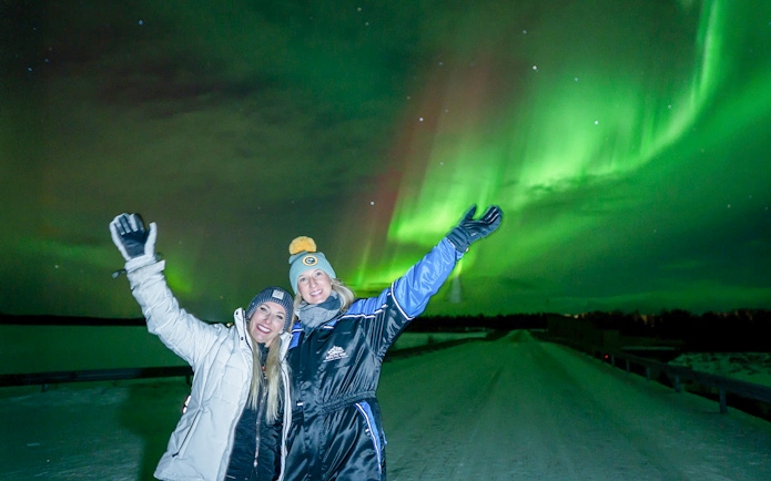 Guests enjoying Northern Lights on tour with unlimited mileage and photography.