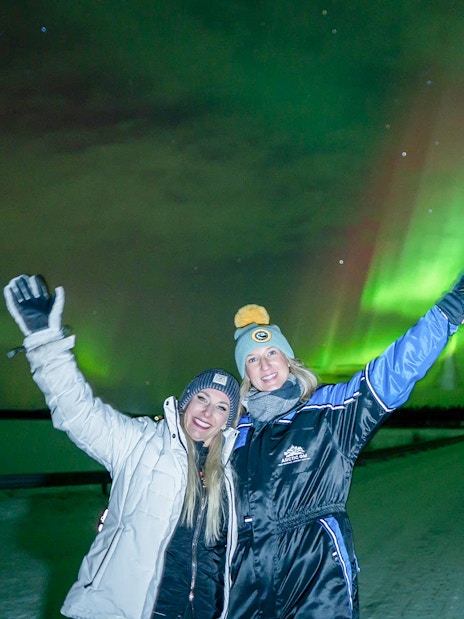 Guests enjoying Northern Lights on tour with unlimited mileage and photography.