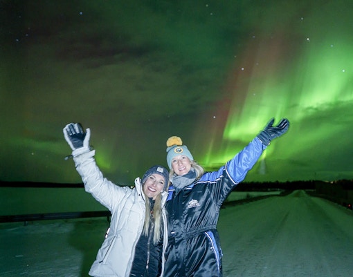 Guests enjoying Northern Lights on tour with unlimited mileage and photography.