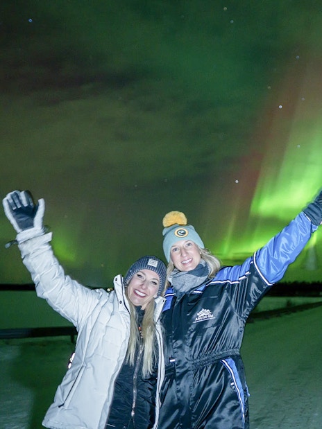 Guests enjoying Northern Lights on tour with unlimited mileage and photography.