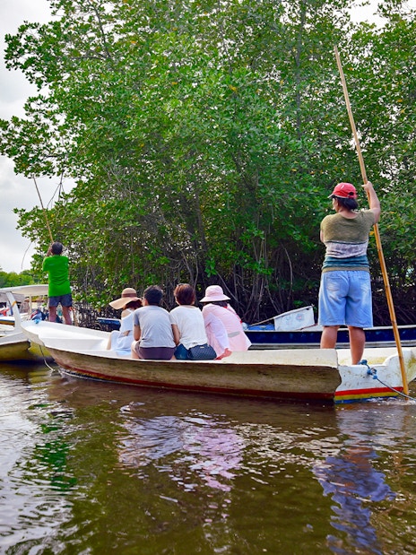 Boats navigating through mangroves on Nusa Lembongan snorkeling tour.