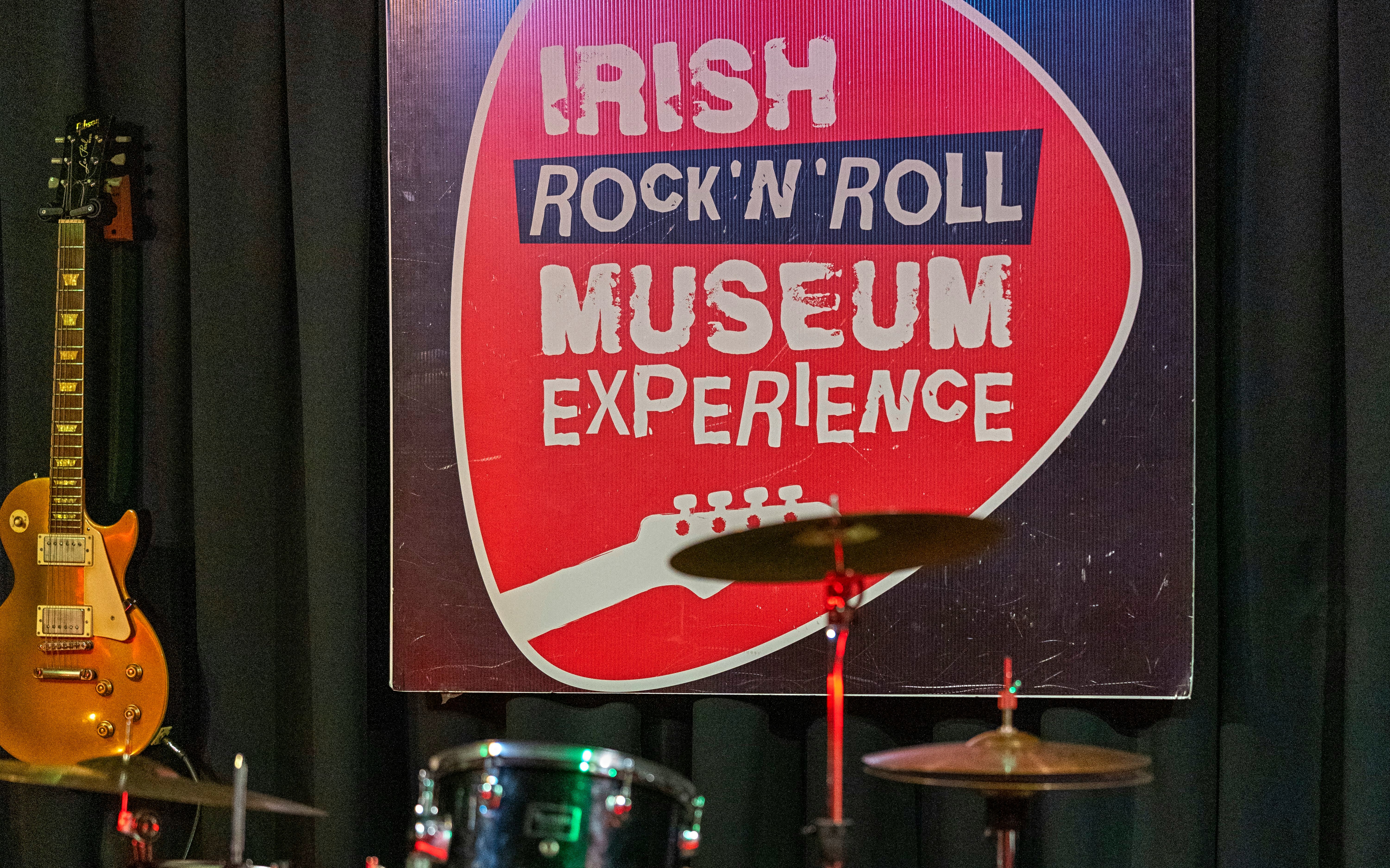 Irish Rock 'n' Roll Museum jam room with guitar and drum set.