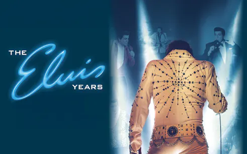 Performer in jeweled jumpsuit on stage, "The Elvis Years" show.