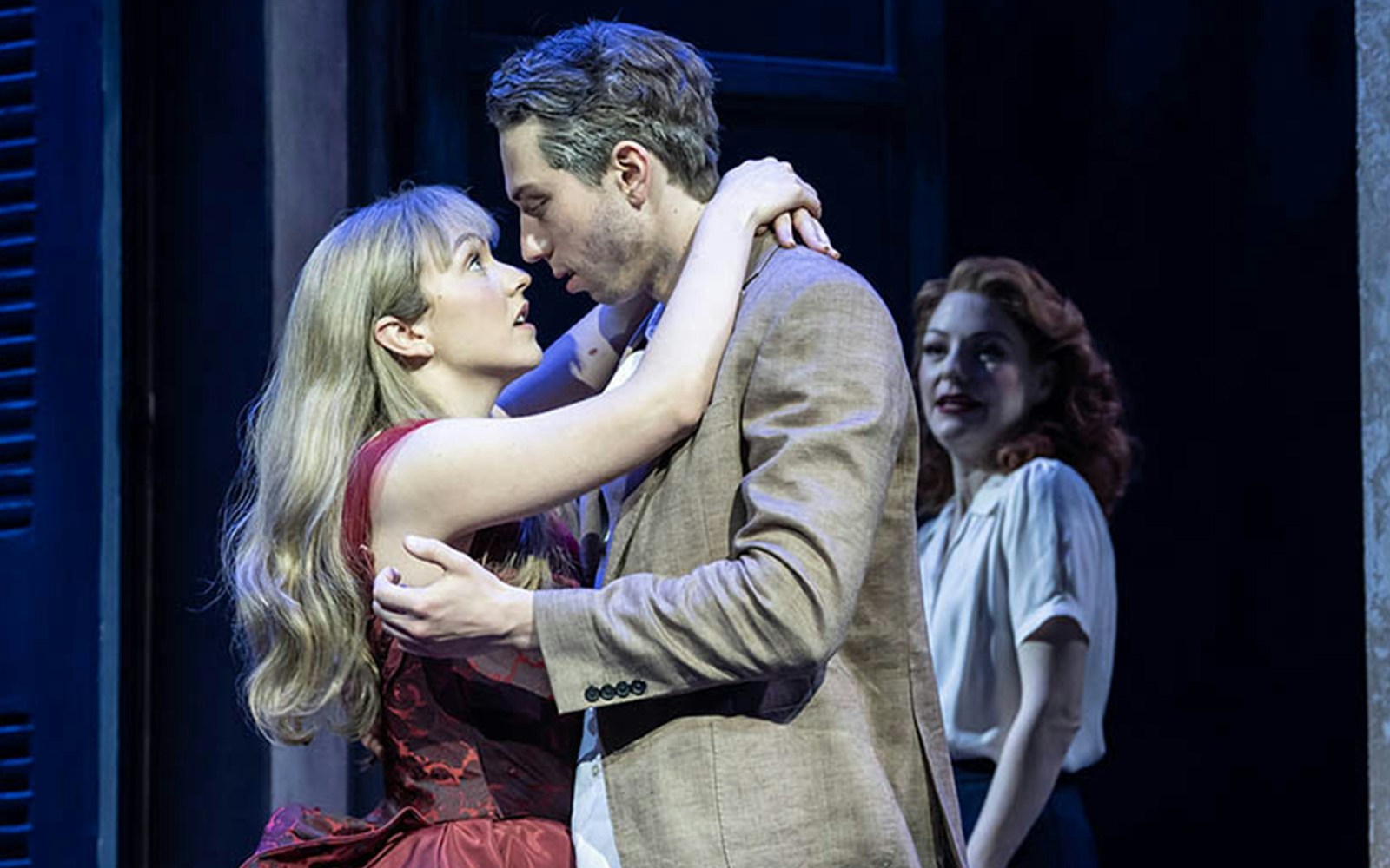 Couple embracing on stage during "Aspects of Love" performance.