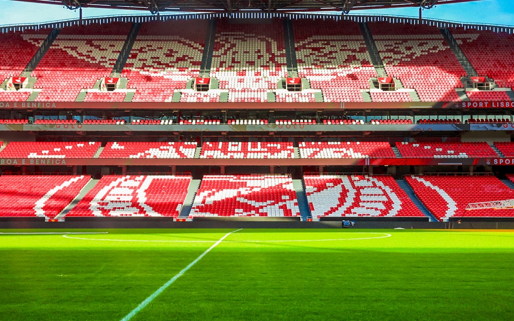 Benfica Stadium seating with red and white patterns, Lisbon, Portugal.
