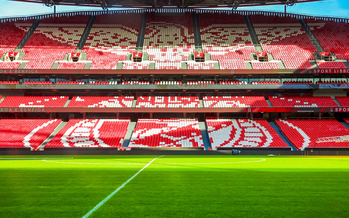 Benfica Stadium seating with red and white patterns, Lisbon, Portugal.