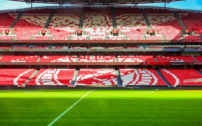 Benfica Stadium seating with red and white patterns, Lisbon, Portugal.