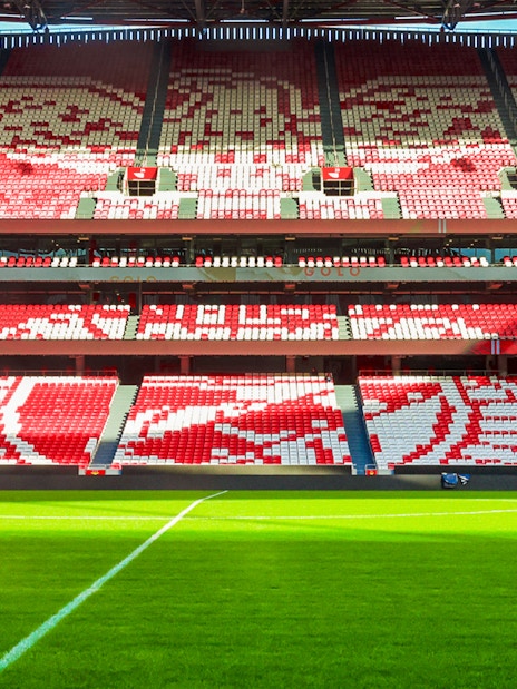 Benfica Stadium seating with red and white patterns, Lisbon, Portugal.