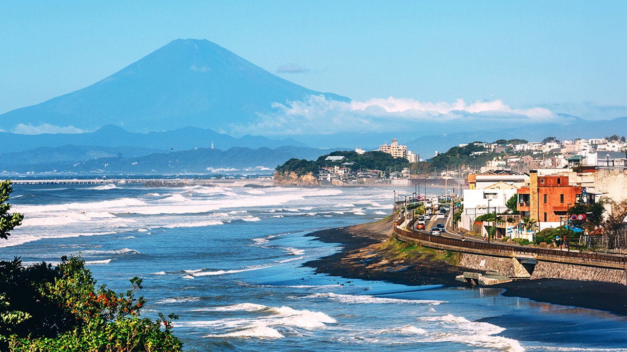 Enoshima Island view with Kamakura Buddha and Enoden train in Tokyo, Japan.