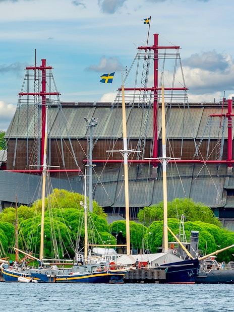 Vasa Museum in Stockholm with ships docked in front.