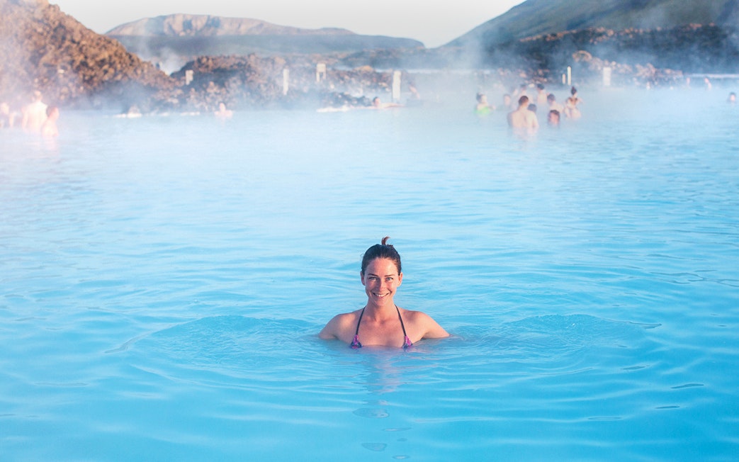 Person enjoying the Blue Lagoon's geothermal waters in Iceland.