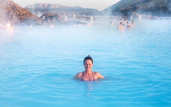Person enjoying the Blue Lagoon's geothermal waters in Iceland.