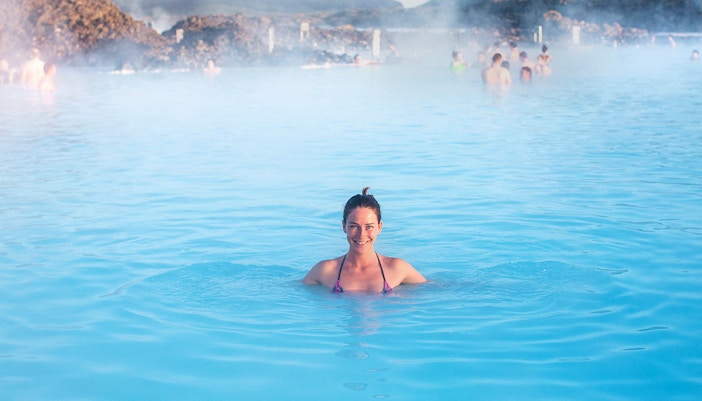 Person enjoying the Blue Lagoon's geothermal waters in Iceland.