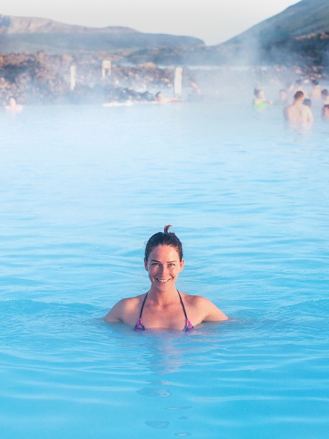 Person enjoying the Blue Lagoon's geothermal waters in Iceland.