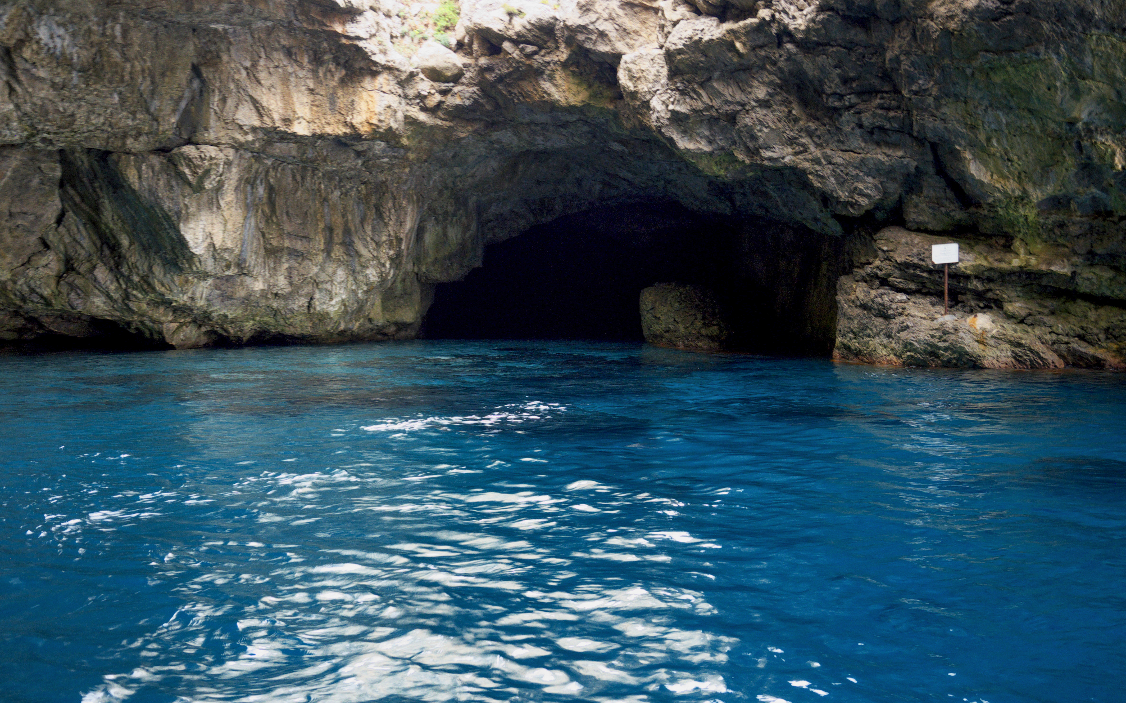 Cave entrance with blue water in Egadi, Sicily, Italy.