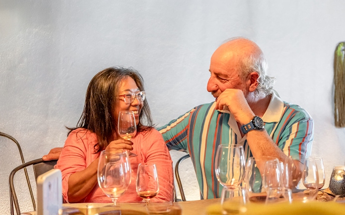 Couple enjoying wine tasting on Douro Historical Tour from Porto.