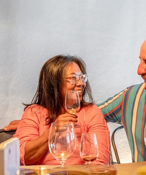 Couple enjoying wine tasting on Douro Historical Tour from Porto.