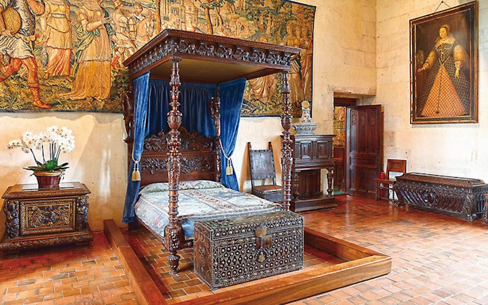 Four-poster bed in a historic room at Domaine du Chaumont-sur-Loire Castle, Loire Valley.