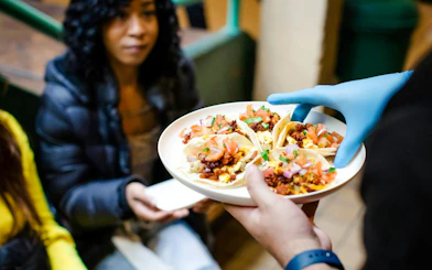 Plate of tacos served during Coffee Crawl VIP Morning Market Experience.