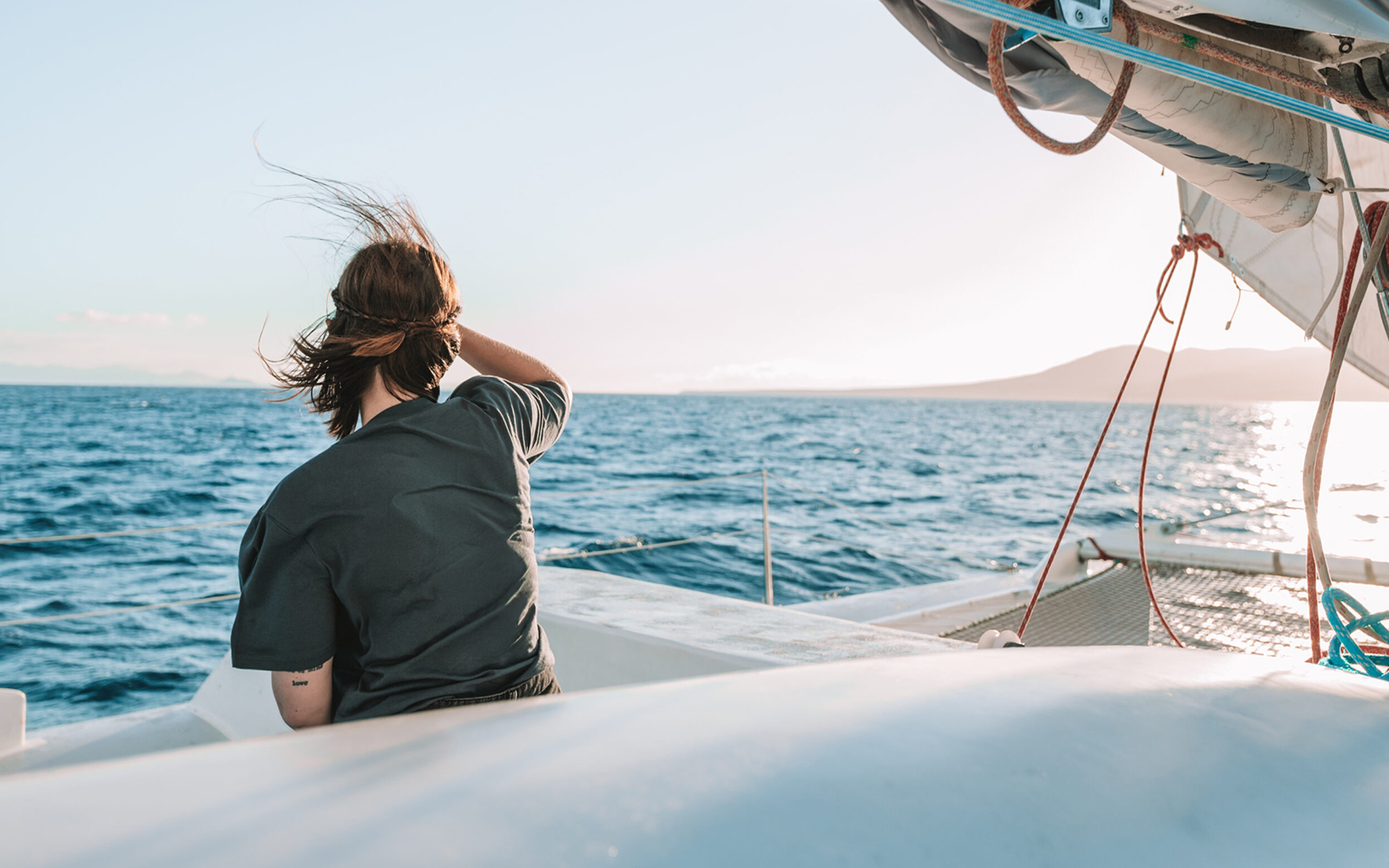 Tourist on a cruise boat in Lanzarote waters, looking out for whales and dolphins.