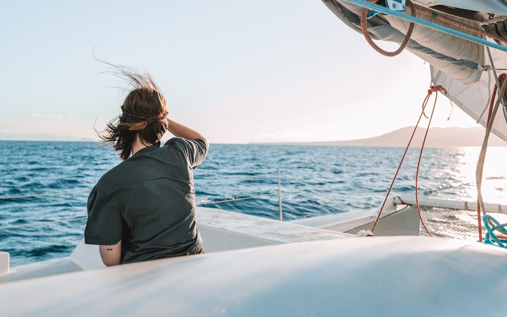 Tourist on a cruise boat in Lanzarote waters, looking out for whales and dolphins.