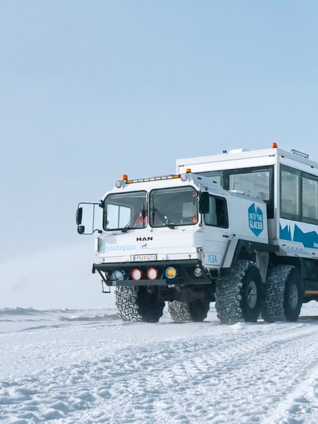 Snow truck on Langjökull glacier used for ice cave adventure tours.