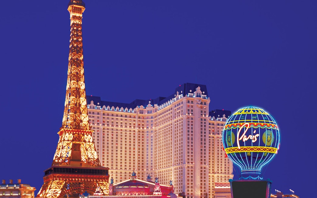 Eiffel Tower replica and Paris Las Vegas hotel at night, Las Vegas.