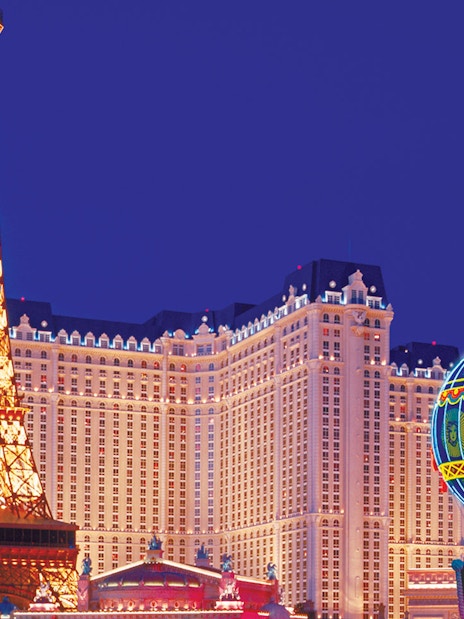 Eiffel Tower replica and Paris Las Vegas hotel at night, Las Vegas.