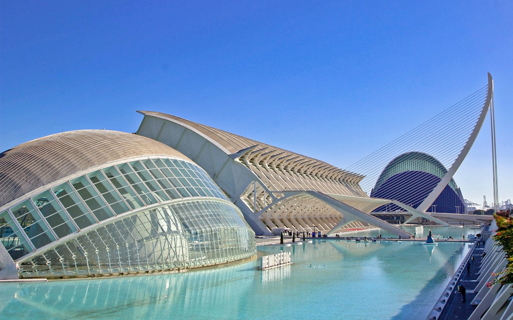 Hemisfèric building in Valencia, Spain, with its distinctive dome and surrounding water.