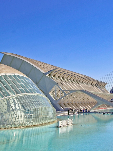 Hemisfèric building in Valencia, Spain, with its distinctive dome and surrounding water.
