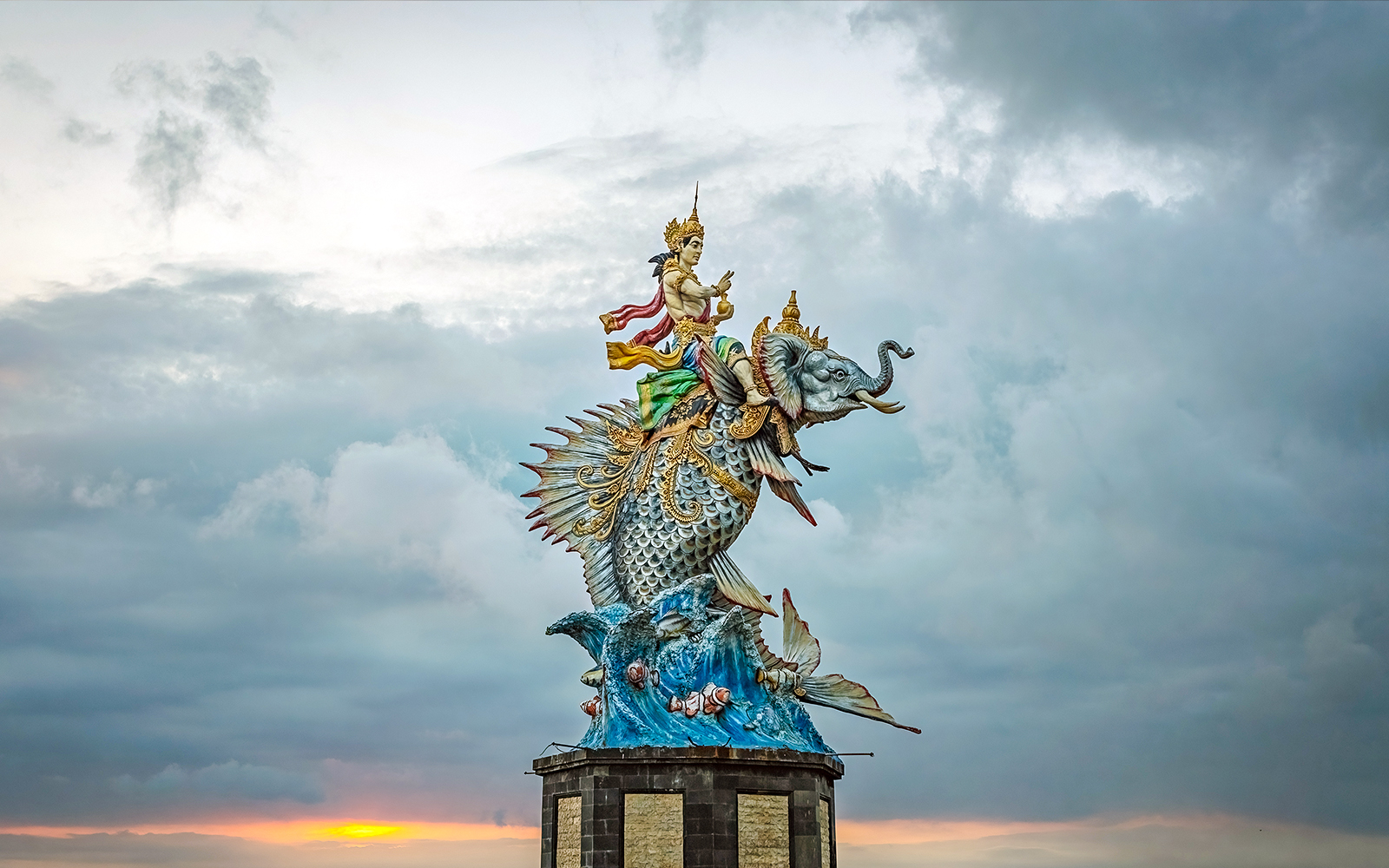 God Baruna statue in Pererenan beach at sunset, Bali, Indonesia