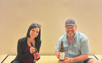 Couple enjoying sake tasting experience in Kyoto with a sake sommelier.