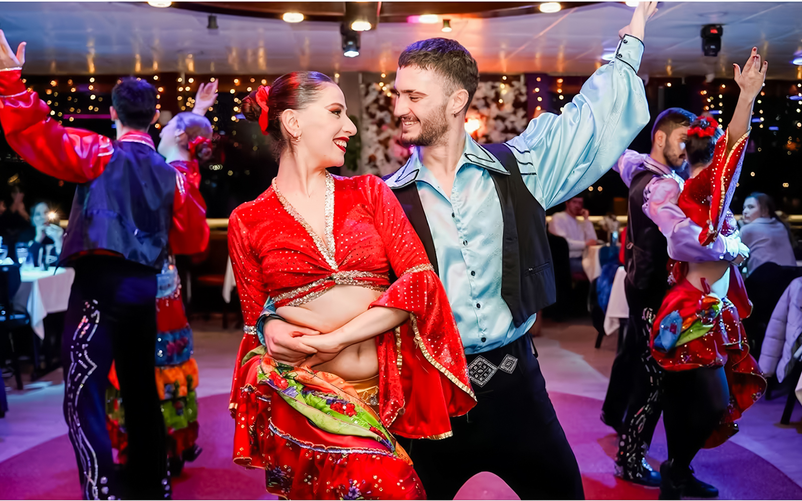 Dancers performing on a Bosphorus night cruise with live entertainment.