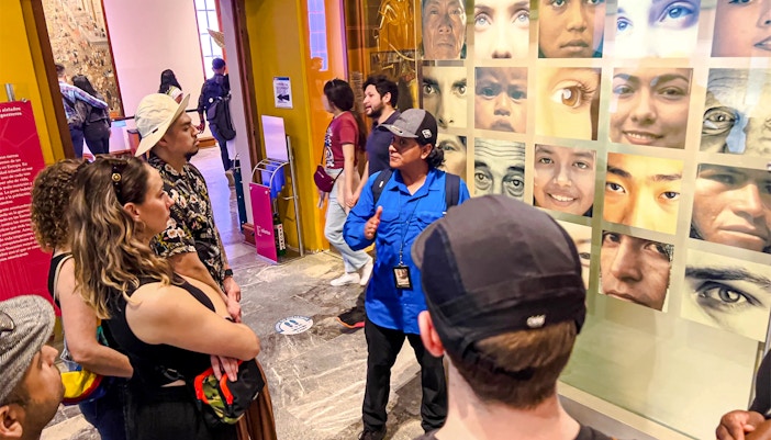 Visitors exploring exhibits at the Anthropology Museum in Mexico City.