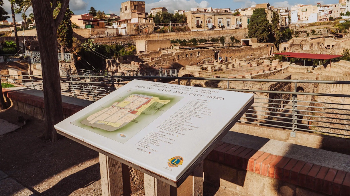 Map display overlooking Herculaneum ruins in Italy.