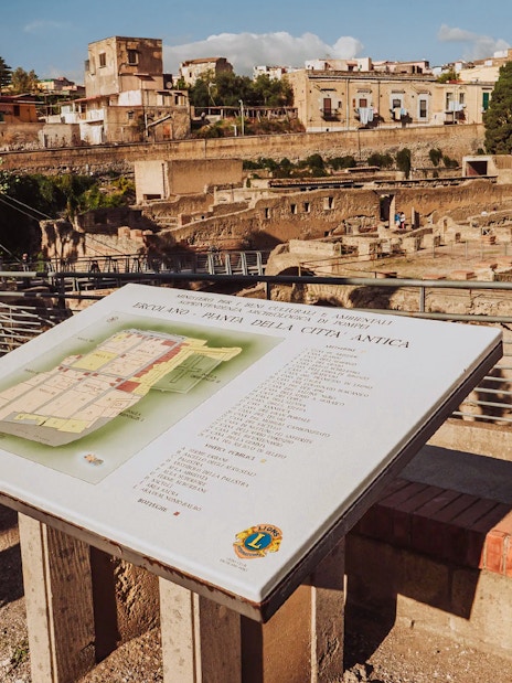 Map display overlooking Herculaneum ruins in Italy.