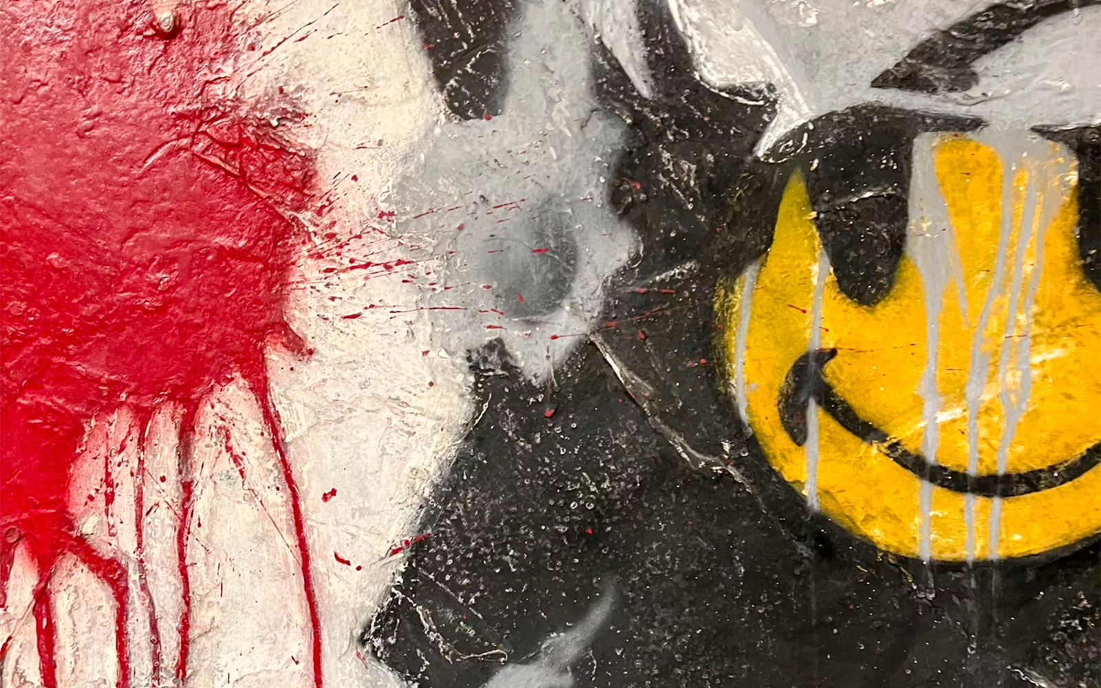 Banksy artwork of a smiling copper in London, showcasing street art culture.