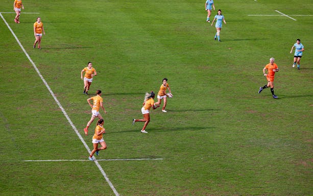 Rugby players in action during Emirates Dubai 7s match.