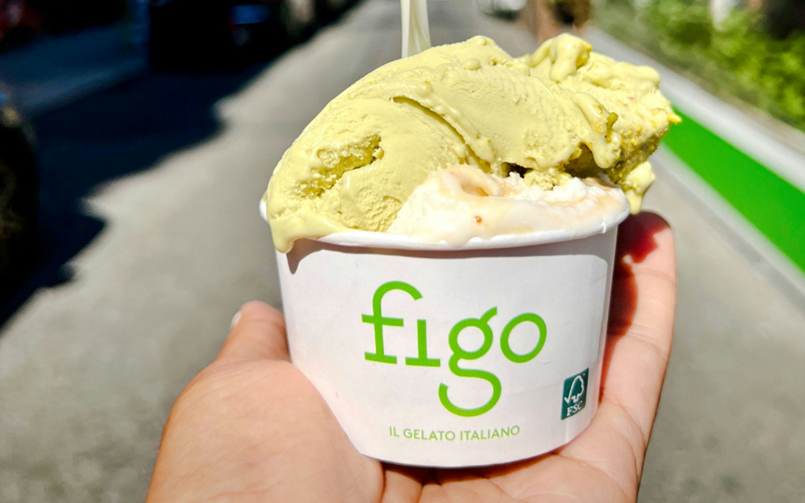 Gelato cup from Figo il Gelato Italiano held in hand outdoors.