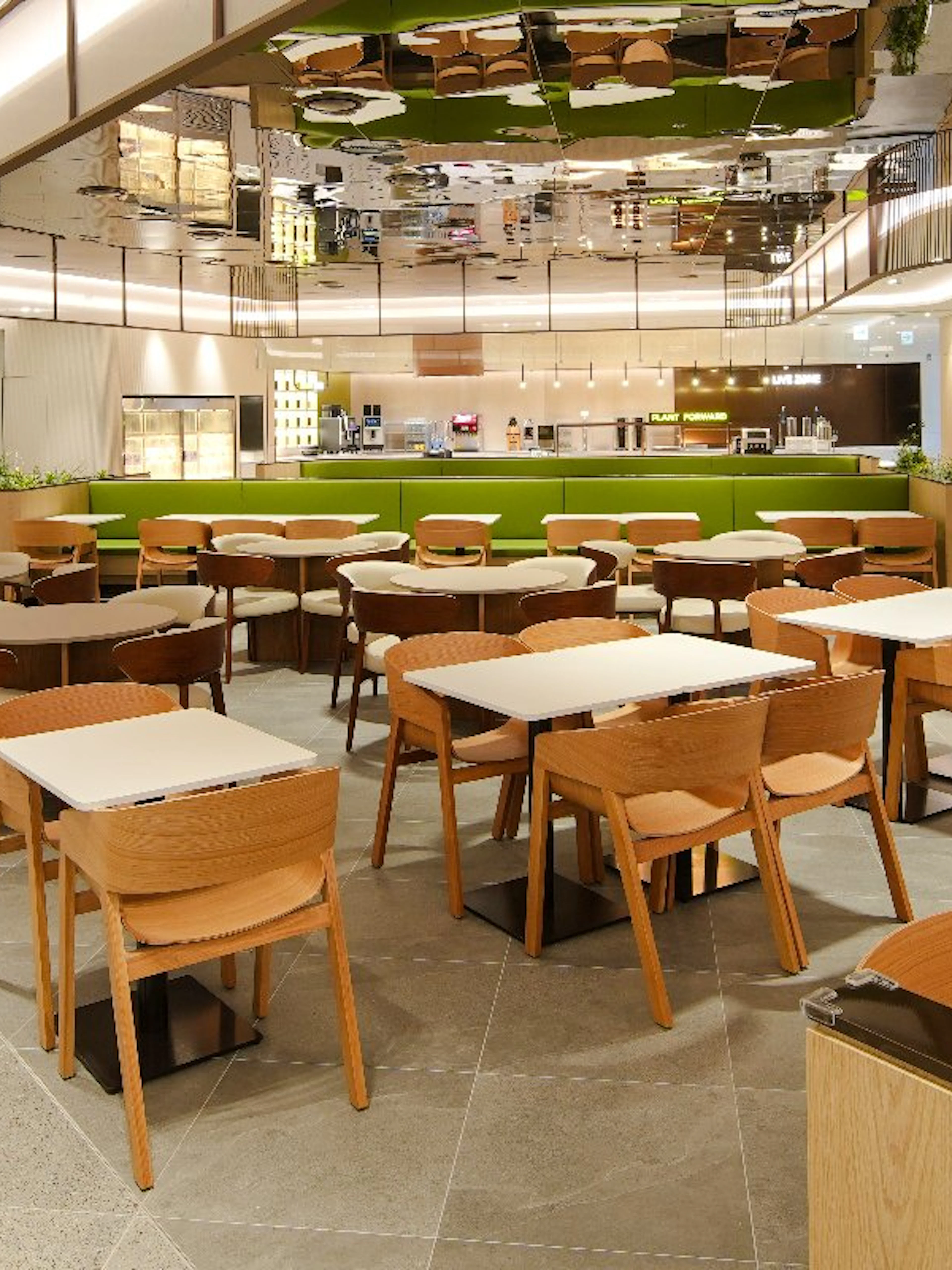 Tables arranged at Plaza Premium Lounge, South Korea, with modern seating and bright interior.
