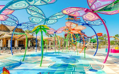 Colorful waterfly ride at The Land Of Legends Theme Park with vibrant butterfly structures.
